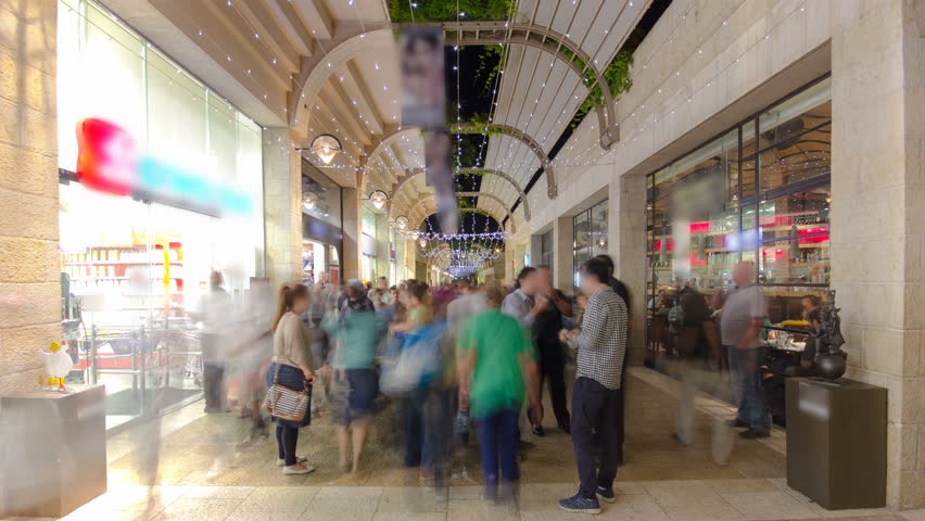 Shoppers and tourists at Mamilla shopping street timelapse hyperlapse in Jerusalem.