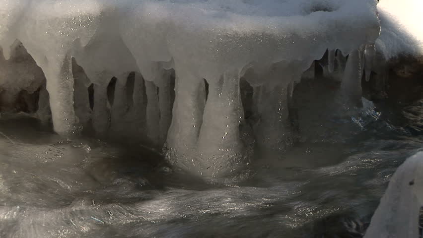 CU of stream rounding cave-like frozen corner
