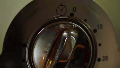 Man Fingers Turning Off The Knob Of An Electric Steam Cooker