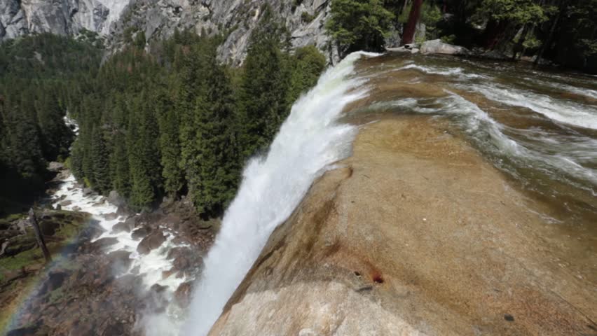 Top of Vernal Fall with rainbow and Yosemite Valley in the backdrop 