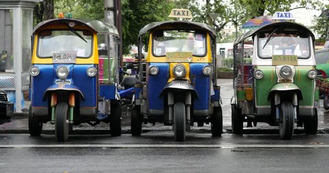 BANGKOK, THAILAND - NOVEMBER 13, 2015: Traditional Tuk Tuk in the street. Auto rickshaws are the fastest ways of getting around congested Bangkok streets. 