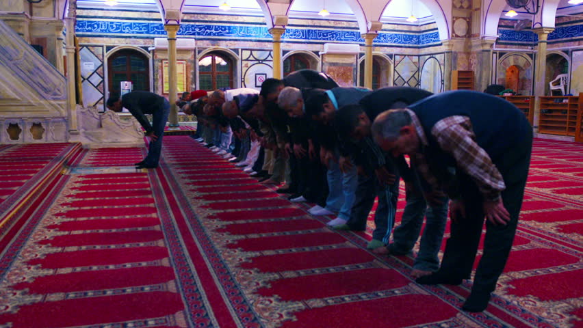 ISRAEL - FEB 2011: Men praying in a Mosque at Akko, Isreal.  Standing and then