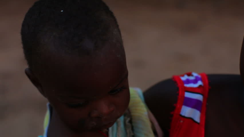 KENYA, AFRICA - CIRCA 2011: Baby looking into the camera in Kenya, Africa.