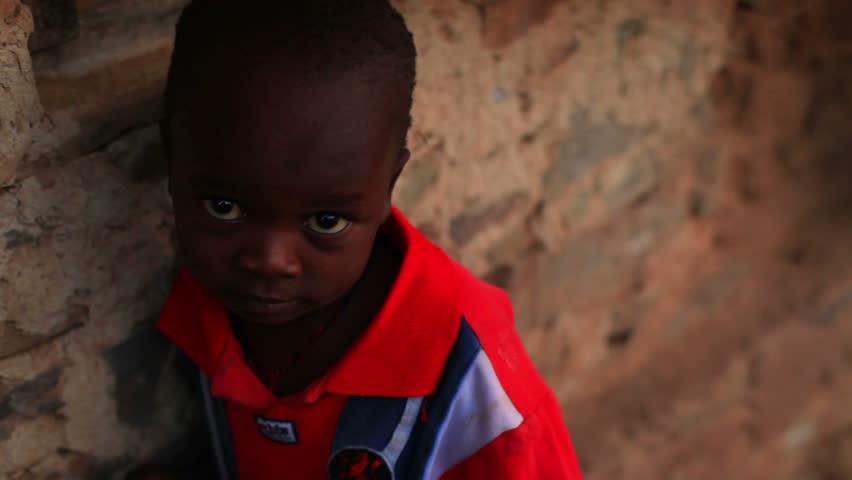 KENYA, AFRICA - CIRCA 2011: Young child looking into the camera in Kenya,