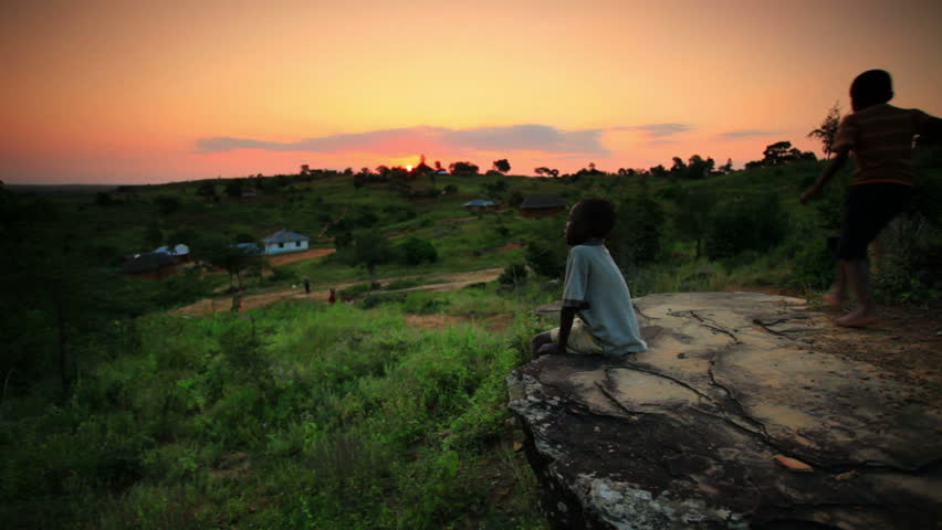 MOMBASSA, KENYA, AFRICA - CIRCA 2011: Kid on rock near Mombassa