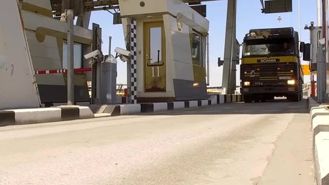 RUSSIA ST.PETERBURG- 28 MAY 2016: truck drives through modern toll road turnpike with traffic lights, entry fee pay gate