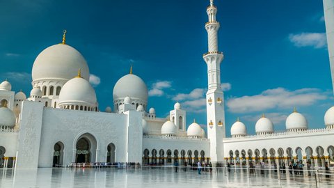 Sheikh Zayed Grand Mosque timelapse located in Abu Dhabi. Mosque was initiated by late President of UAE Sheikh Zayed bin Sultan Al Nahyan. It is largest mosque in UAE. Blue cloudy sky