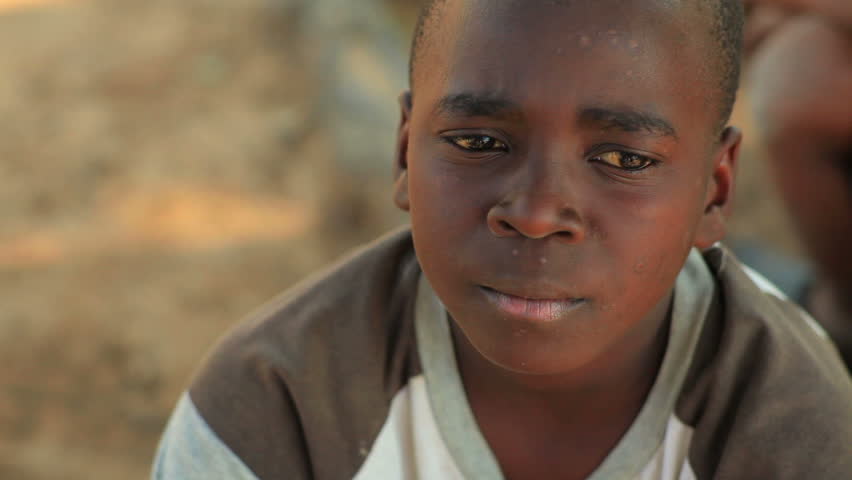 KENYA, AFRICA - CIRCA 2011: A little boy looking at the camera.