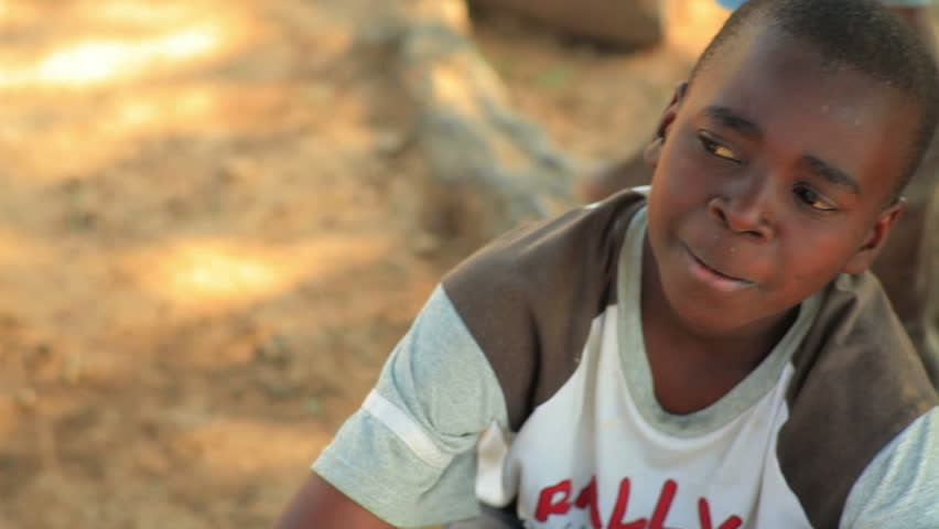 KENYA, AFRICA - CIRCA 2011: A boy talking to the camera