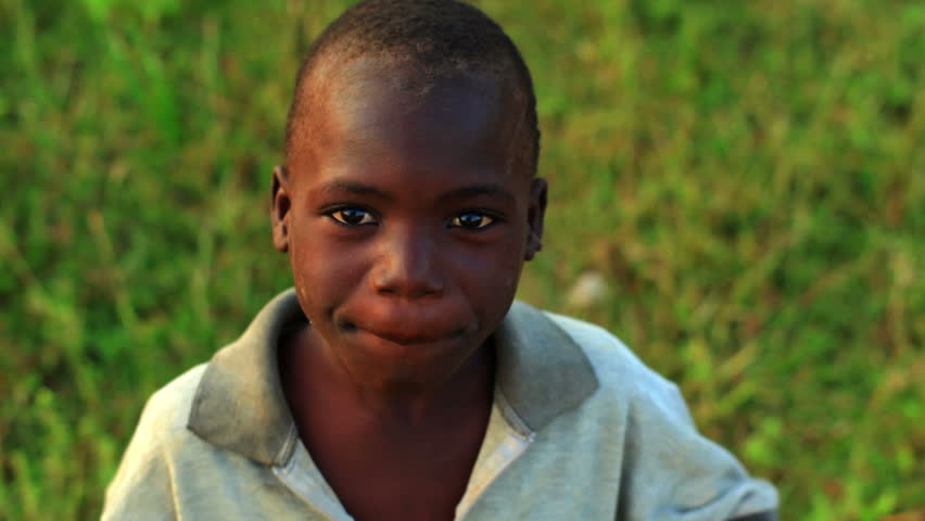 KENYA, AFRICA - CIRCA 2011: A boy with his hands on his hips looking at the