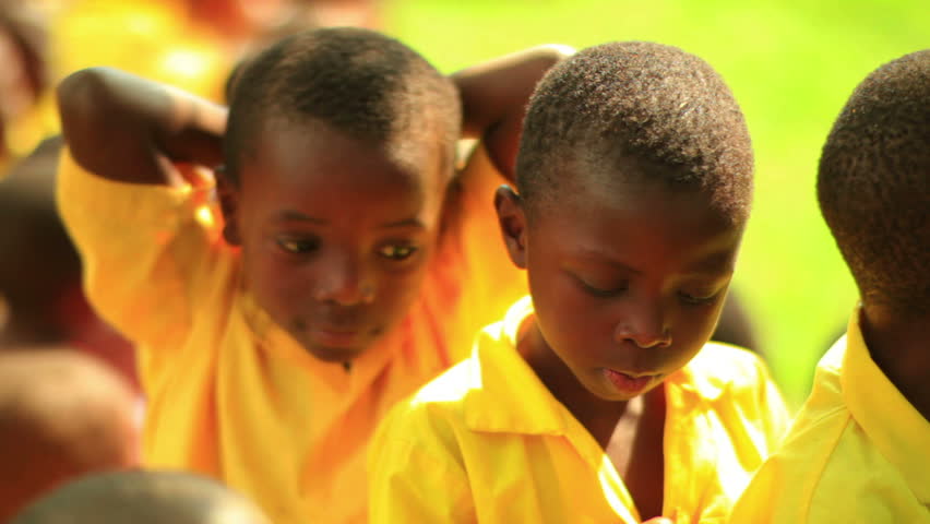 KENYA, AFRICA - CIRCA 2011: Boys making faces at the camera.