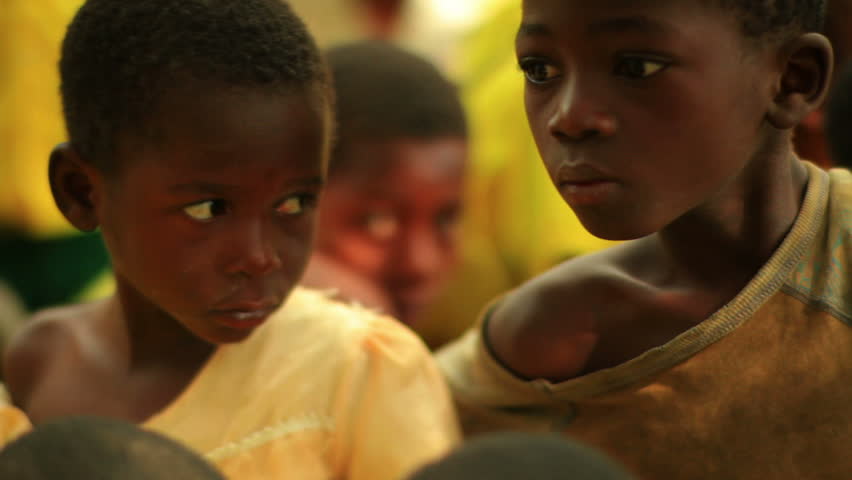 KENYA, AFRICA - CIRCA 2011: A boy with a big ripped shirt.