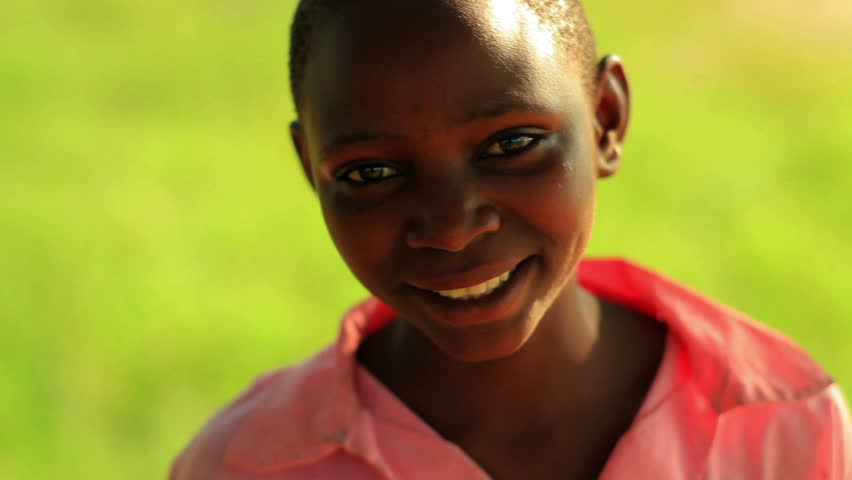 KENYA, AFRICA - CIRCA 2011: Little girl smiling and laughing at the camera.