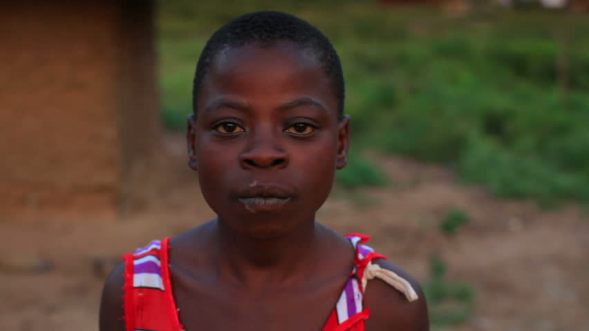 KENYA, AFRICA - CIRCA 2011: A very skinny girl looking at the camera.