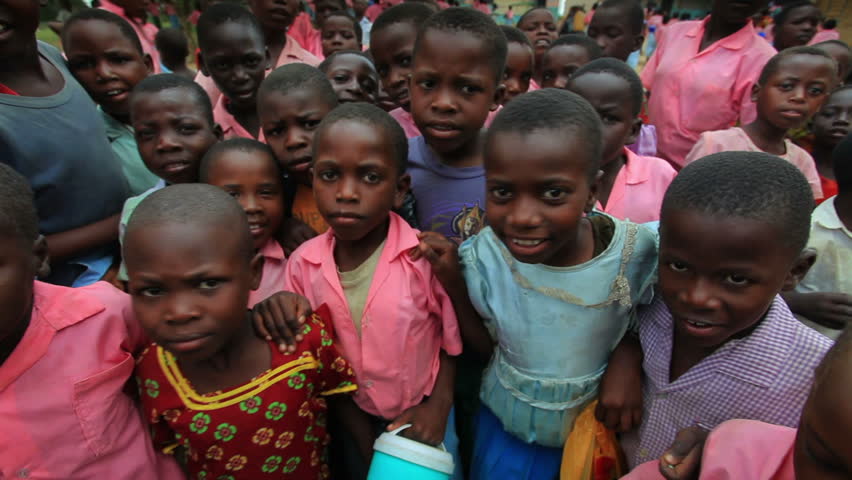 KENYA, AFRICA - CIRCA 2011: Children swarm around the camera.