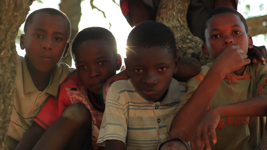 KENYA, AFRICA - CIRCA 2011: Children sitting in a tree.