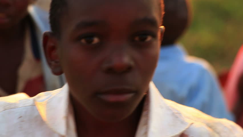 KENYA, AFRICA - CIRCA 2011: Boys look at camera.