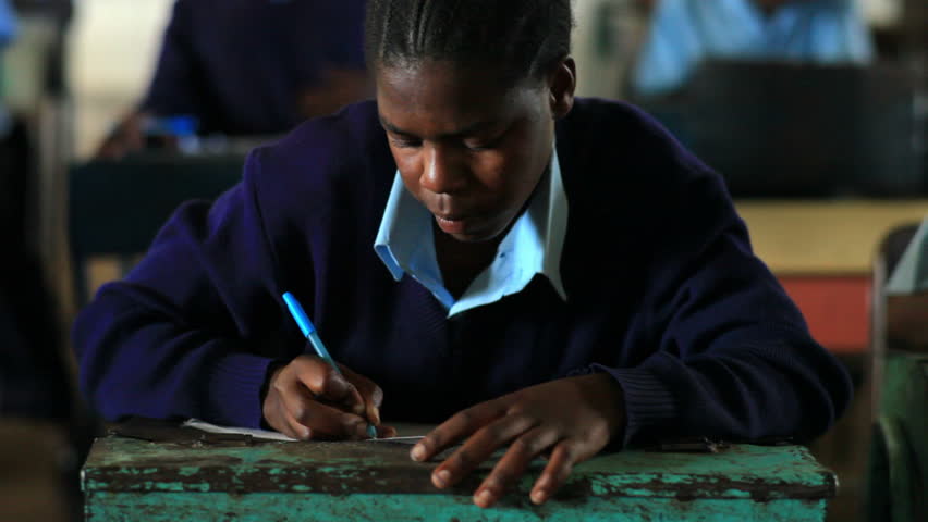 KENYA, AFRICA - CIRCA 2011: Close up of student doing classwork in Kenya,
