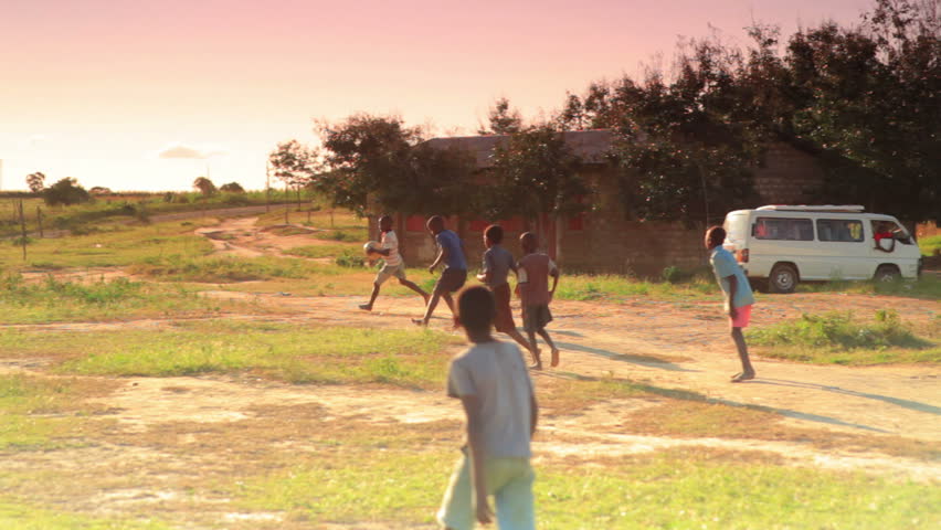 KENYA, AFRICA - CIRCA 2011:  Children playing soccer on the fields in Kenya,