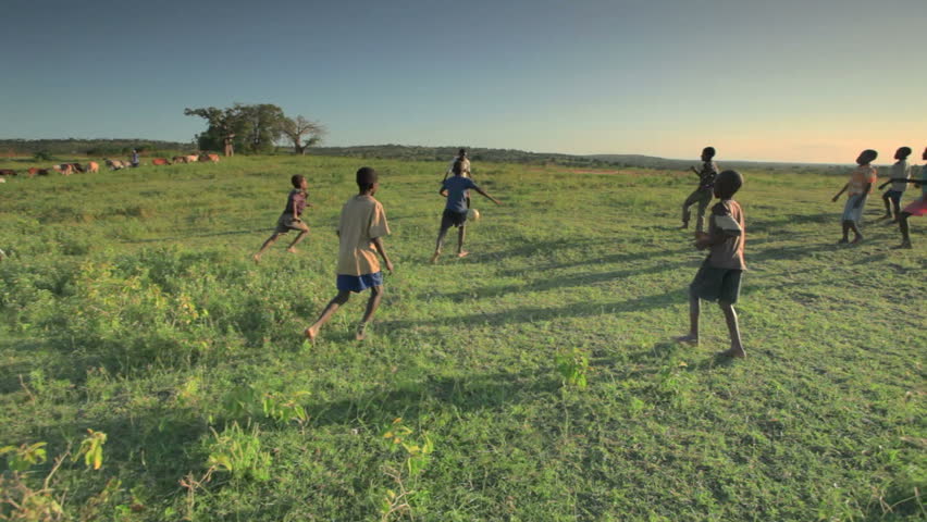 KENYA, AFRICA - CIRCA 2011:  Children playing soccer on the fields in Kenya, Africa. | Shutterstock HD Video #1724659