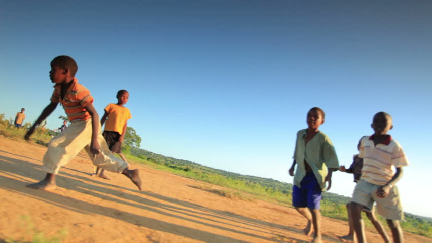 KENYA, AFRICA - CIRCA 2011:  Children playing soccer on the fields in Kenya,