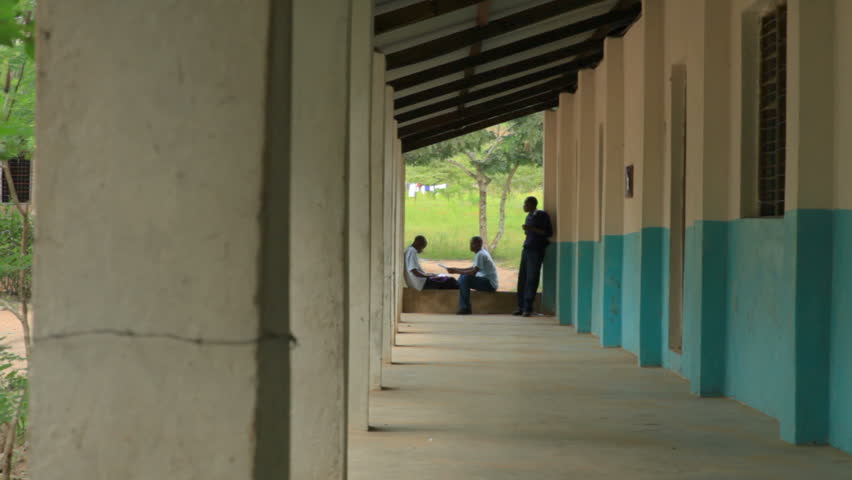 KENYA, AFRICA - CIRCA 2011: Shot of two school boys studying, and one boy