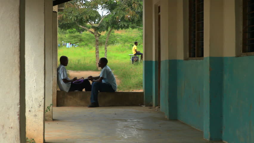 KENYA, AFRICA - CIRCA 2011: Shot of two school boys studying in an outside