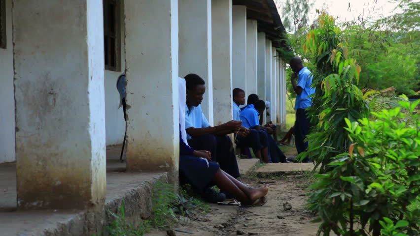 KENYA, AFRICA - CIRCA 2011:  Exterior shot of students talking outside of a