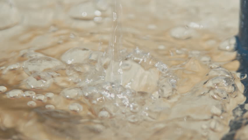 Drops of water falling into the water fountain, Sunny weather | Shutterstock HD Video #17248975