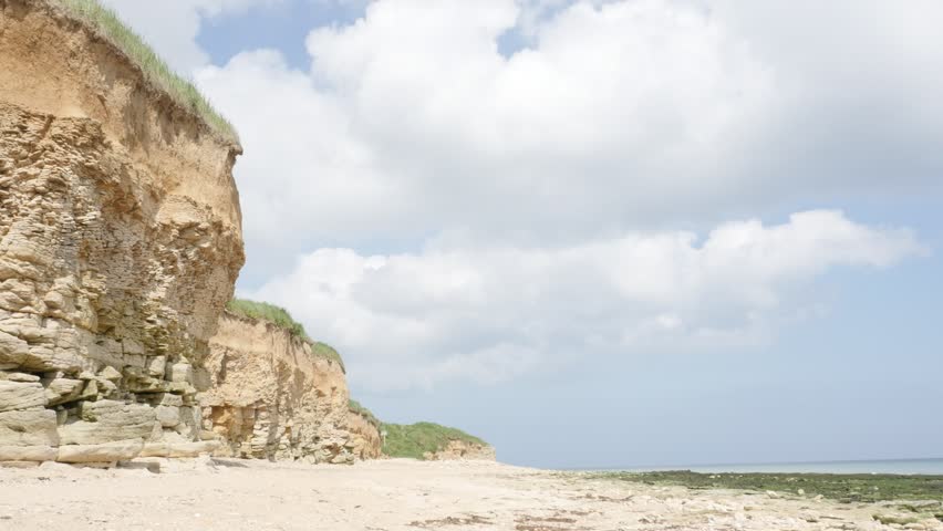 Sword beach D-Day landing area in northern France Normandy 4K 2160p 30 fps UltraHD tilting footage - Operation Overlord WW2 allies Sword beach by the day slow tilt 4K 3840X2160 UHD video