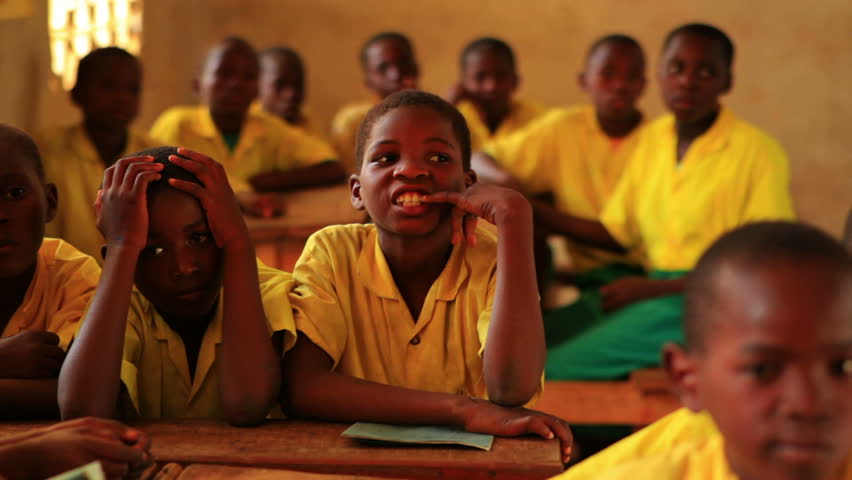 KENYA, AFRICA - CIRCA 2011: .Back view of schools boys in class in Kenya,