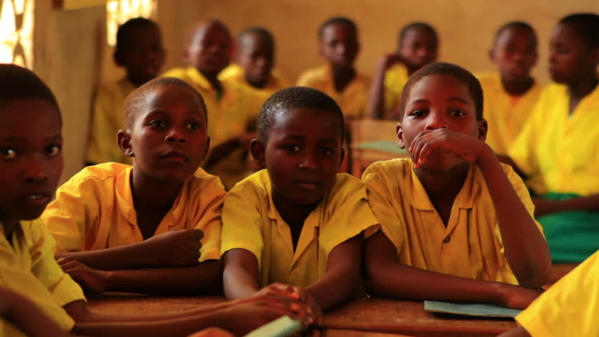 KENYA, AFRICA - CIRCA 2011: .Back view of schools boys in class in Kenya,