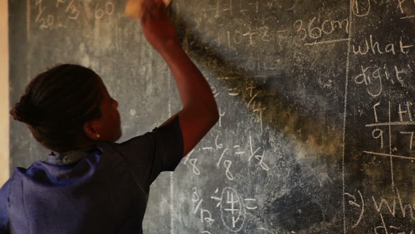KENYA, AFRICA - CIRCA 2011: Close up of teacher erasing chalkboard in Kenya,