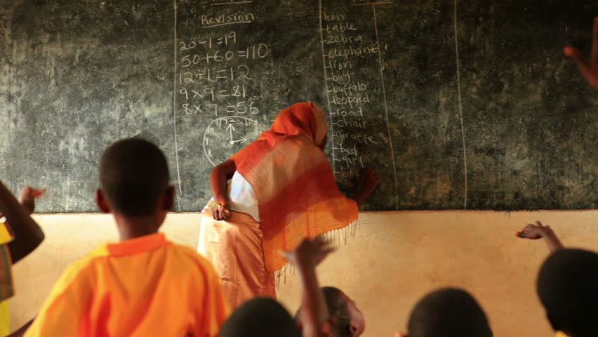KENYA, AFRICA - CIRCA 2011: Close up of the teacher in full classroom in Kenya,