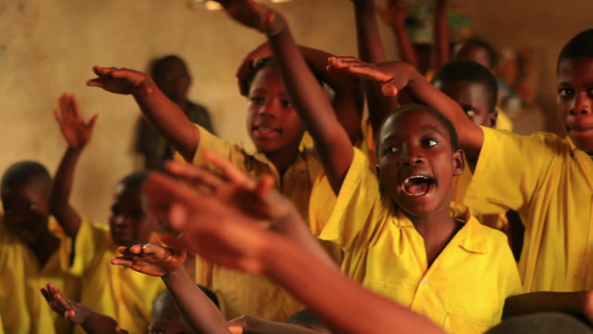 KENYA, AFRICA - CIRCA 2011: Close up of boys raising his hand in a full