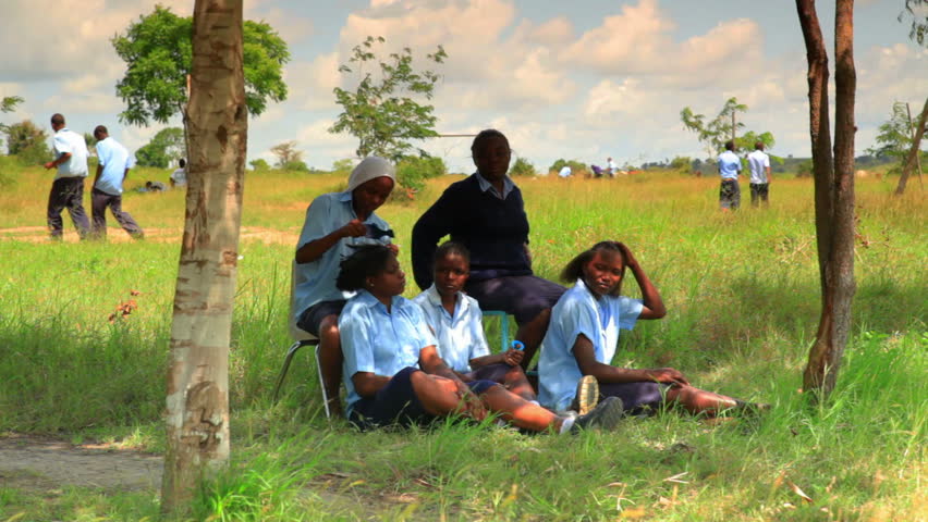 MOMBASSA, KENYA, AFRICA - CIRCA 2011: Students and workers taking a break from