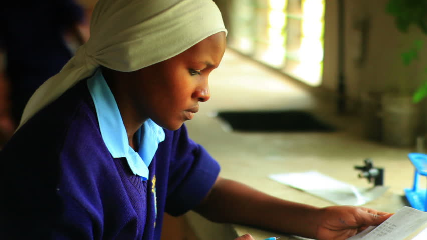 KENYA, AFRICA - CIRCA 2011: Close up of girl doing chemistry in Kenya, Africa.