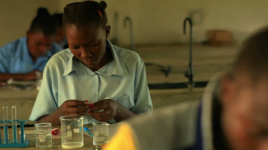 KENYA, AFRICA - CIRCA 2011: School girls doing chemistry in Kenya, Africa.