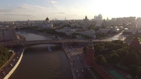 Flight over Moscow Kremlin near Red square. City center, downtown. Day road traffic. Unique aerial FPV Drone shot. High altitude. Warm sunset. UltraHD 4K
