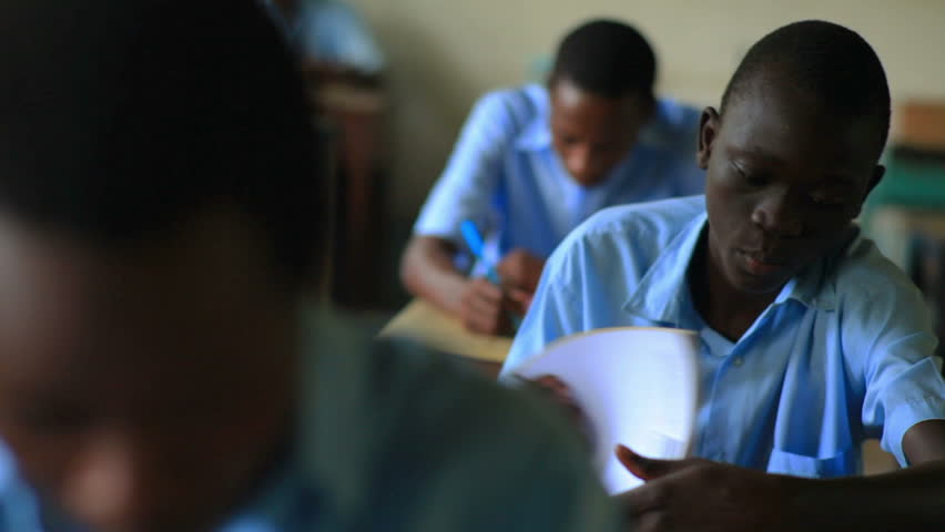 MOMBASSA, KENYA, AFRICA - CIRCA 2011: Students taking a test in class in a school in a village in Kenya | Shutterstock HD Video #1725361