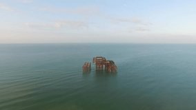 Ruined by fire, burnt West Brighton Pier remains, 4K aerial video, Brighton, East Sussex, UK, May 27, 2016