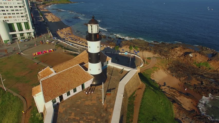 Aerial view of Farol da Barra Lighthouse at sunset in Salvador, Bahia, Brazil. Dating from the year 1698, it is said to be the oldest lighthouse in South America.