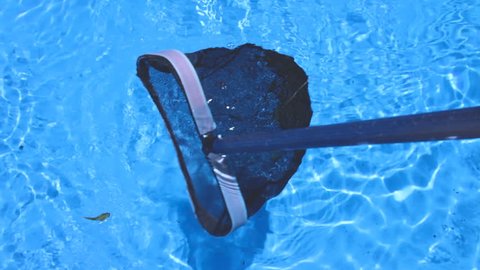 Closeup of A Net Cleaning A Swimming Pool