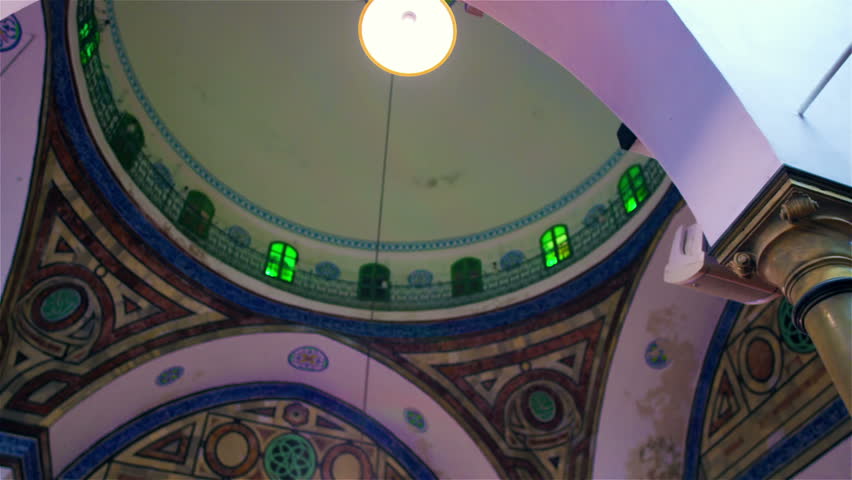 ISRAEL - FEB 2011: interior dome past a pillar.  Beautiful colors, in a mosque