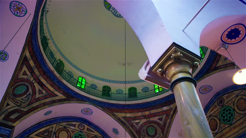 ISRAEL - FEB 2011: interior dome past a pillar.  Beautiful colors, in a mosque