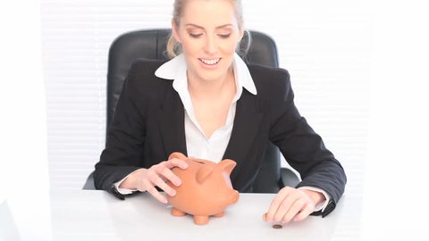 Businesswoman With Piggy Bank and coin in savings concept