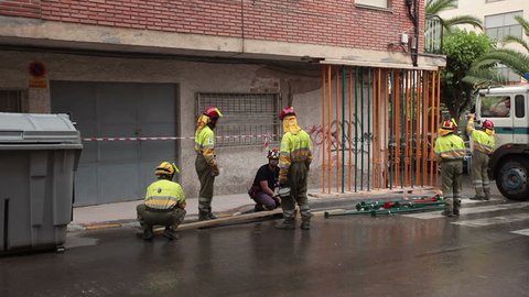 LORCA, SPAIN - MAY 20, 2011: Earth quake destruction in Lorca, Spain on May 20, 2011, several days after event. Stabilize balcony on business. Army and rescue personnel working to stabilize buildings and clean up the mess. 