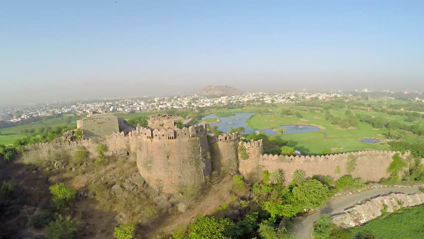 fly over a fort wall with a moat