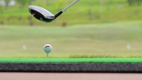 Close up ball. Golfer hits ball with iron
