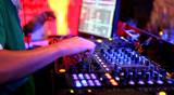 DJ plays music in a nightclub